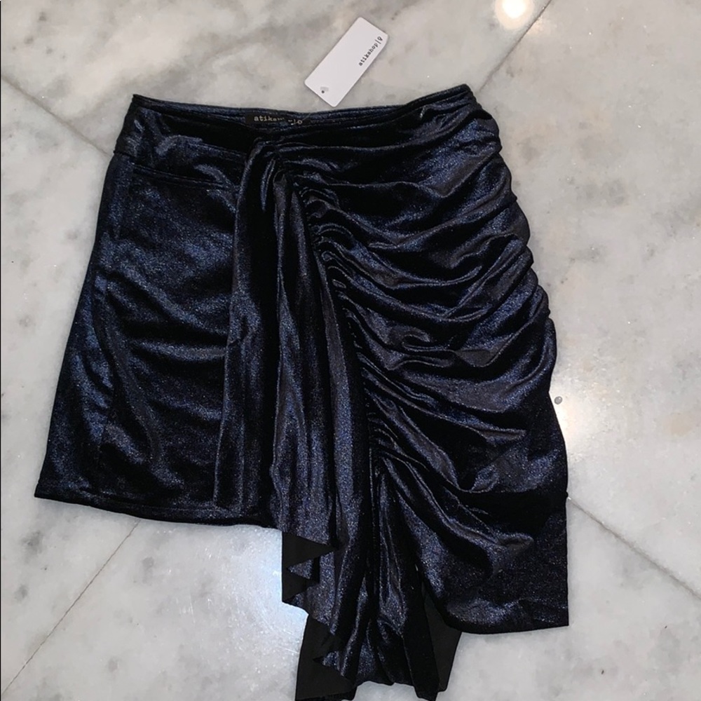 Asymmetrical dark blue skirt with shine